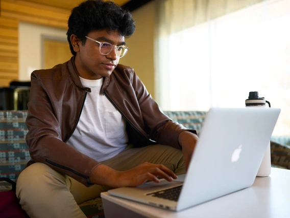 Picture of student in front of computer