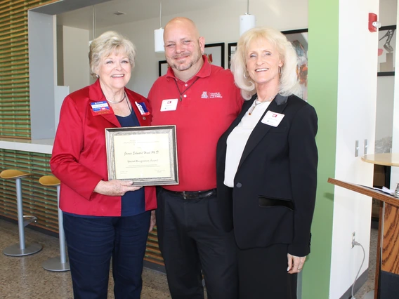 A former Norton School Graduate Student receiving an award