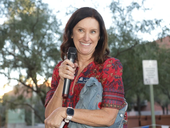 Dr. Laura Scaramella hosts the alumni fashion show at the Norton School Homecoming Celebration