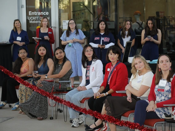 Generations of Wildcats watch the alumni fashion show at the Norton School Homecoming Celebration.