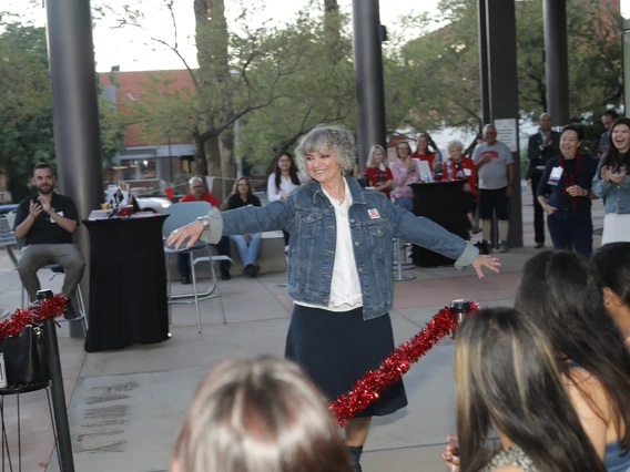 A Norton alumna twirls on the catwalk at the Norton Alumni Fashion show