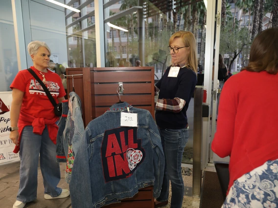 Norton alumni browse at the Homecoming auction