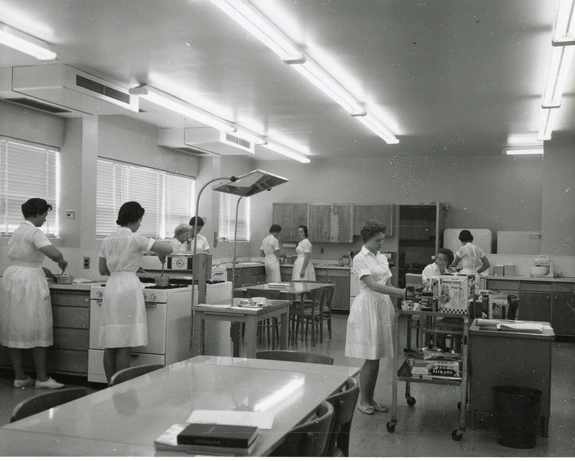 historical photo of women conducting research in a lab