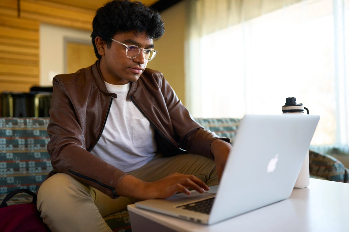 Picture of student in front of computer