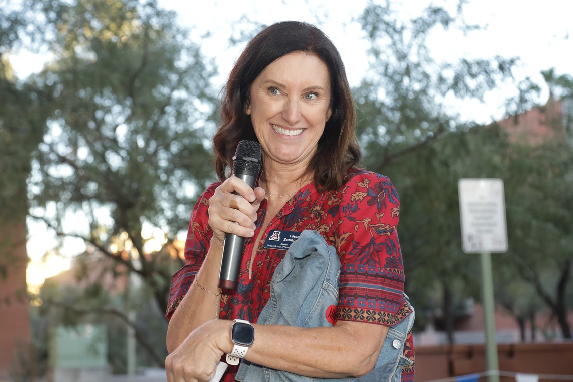 Dr. Laura Scaramella hosts the alumni fashion show at the Norton School Homecoming Celebration