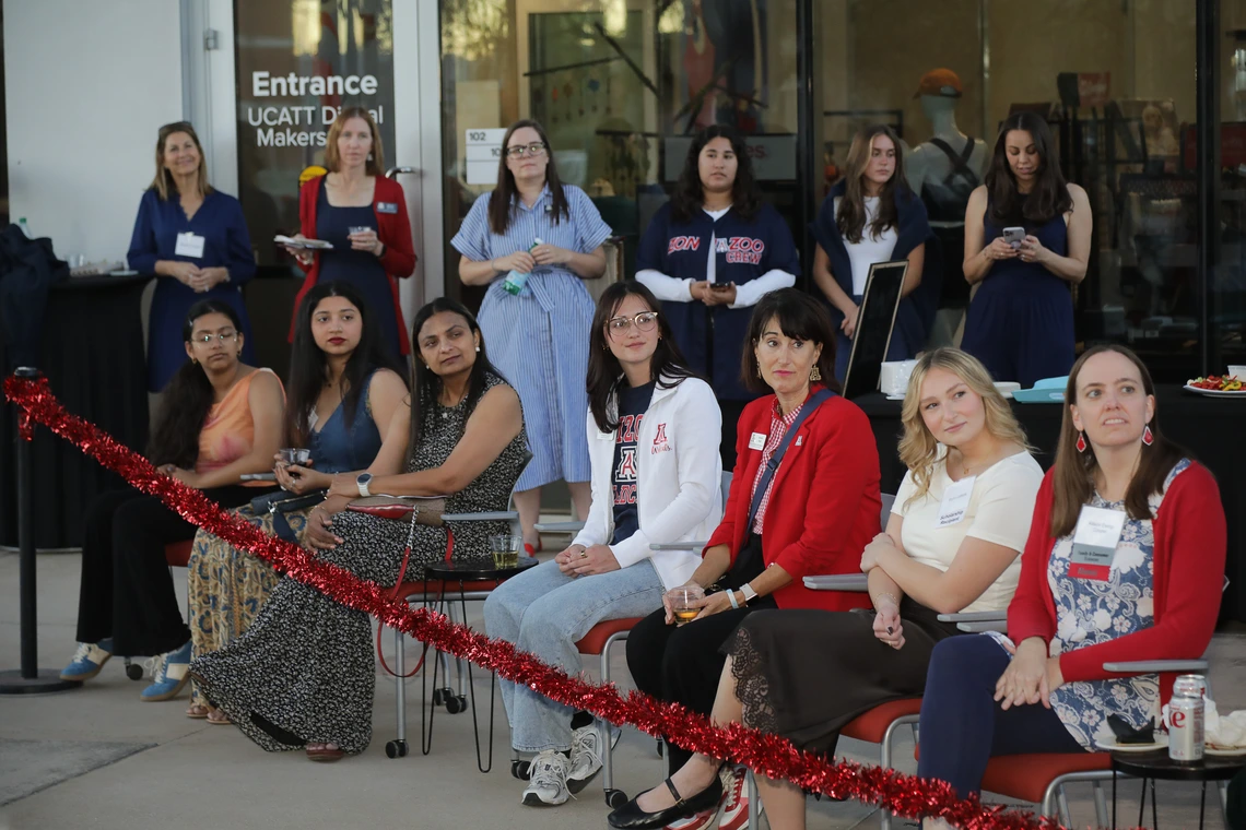 Generations of Wildcats watch the alumni fashion show at the Norton School Homecoming Celebration.