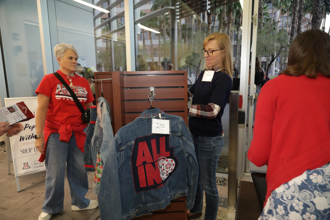 Norton alumni browse at the Homecoming auction