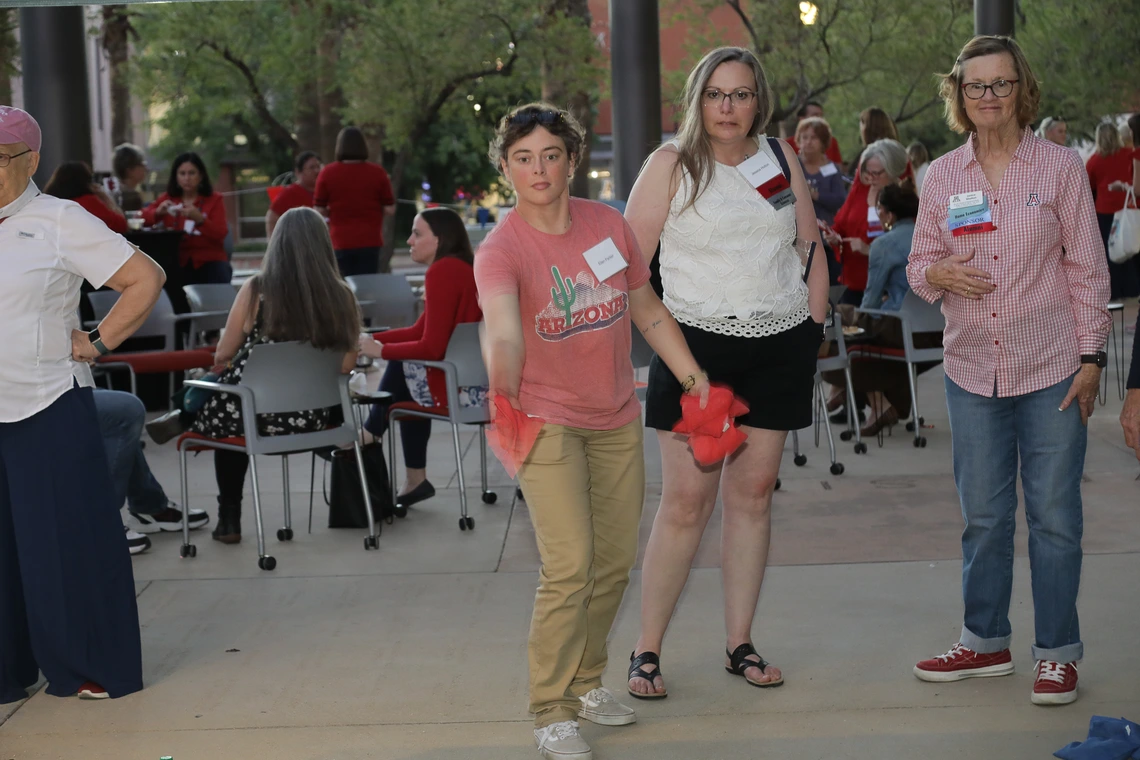 Wildcats play a cornhole game outside Mclelland Park