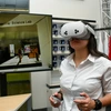 Retailing and consumer science student Nicole Gil-Lopez uses a Meta Quest 3 headset to explore the student‐created virtual reality “digital twin” of the Lundgren Consumer Science Lab. She and her classmates in a merchandising systems course are using extended reality technology to discover new ways of learning.
